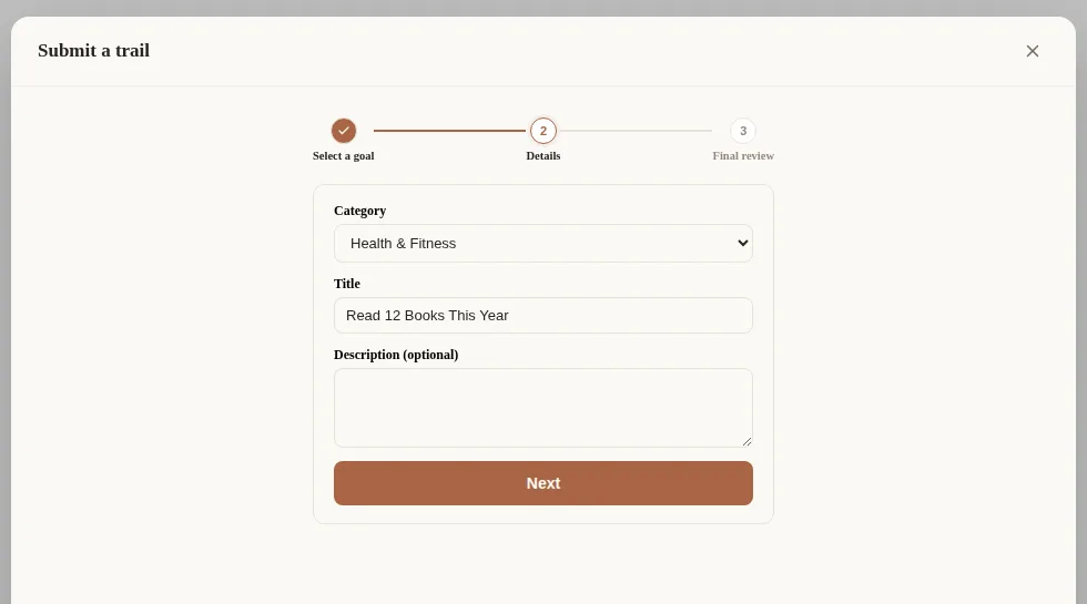 The trail submission wizard. Step 1 (pick a goal) is marked done, and step 2 (fill it in) shows category, title, and description fields